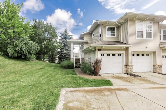 101 Stonegate Cir, Seven Hills, OH 44131 - view of property exterior with an attached garage, concrete driveway, a lawn, and stone siding