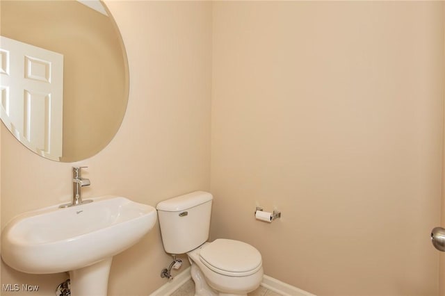 101 Stonegate Cir, Seven Hills, OH 44131 - half bath with a sink and tile patterned floors