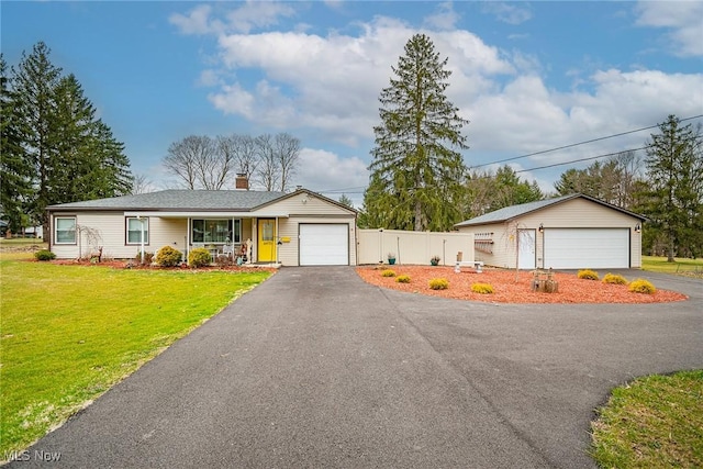 6470 Duncan Dr, Poland, OH 44514 - ranch-style home with a chimney, a porch, and an outbuilding
