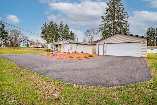 6470 Duncan Dr, Poland, OH 44514 - view of front of property with a garage, an outdoor structure, and driveway