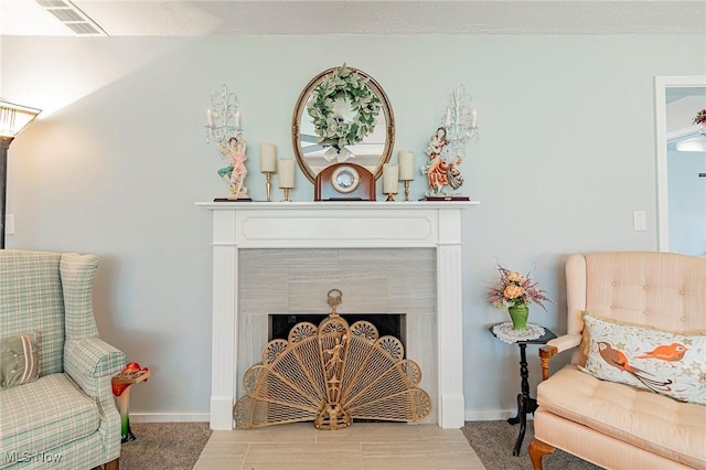 6470 Duncan Dr, Poland, OH 44514 - living area with a tiled fireplace and baseboards