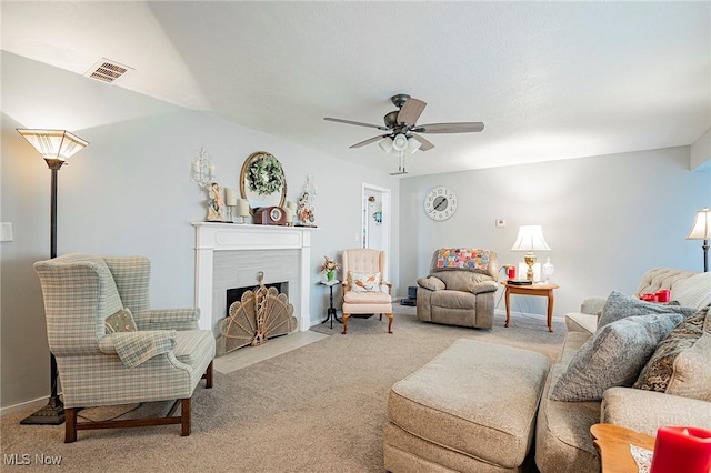 6470 Duncan Dr, Poland, OH 44514 - carpeted living area with ceiling fan and a fireplace with flush hearth