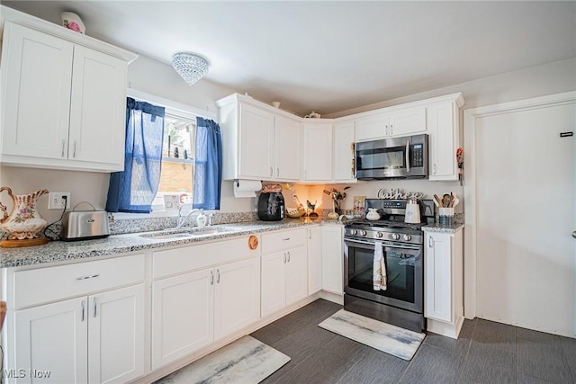 6470 Duncan Dr, Poland, OH 44514 - kitchen with appliances with stainless steel finishes, white cabinets, and light stone counters