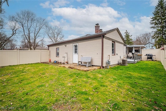 6470 Duncan Dr, Poland, OH 44514 - back of property with a fenced backyard and a chimney