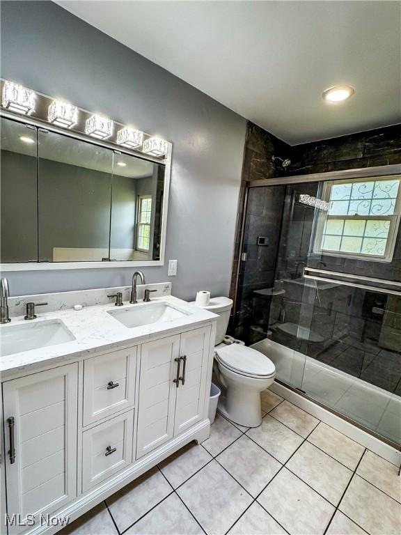 38 Lake Dr, Parkersburg, WV 26104 - bathroom with double vanity, a shower stall, and tile patterned flooring