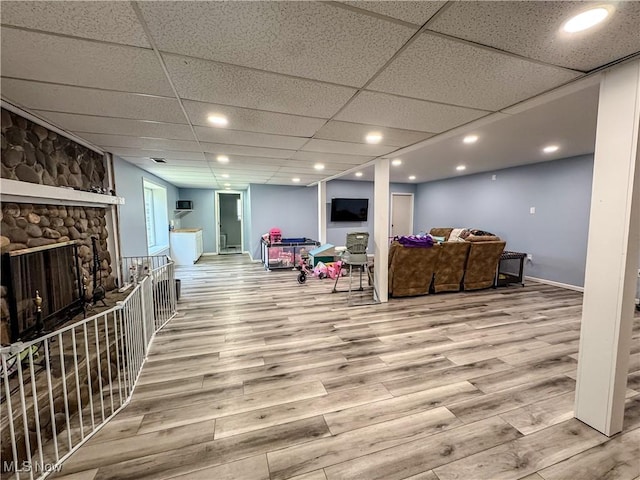 38 Lake Dr, Parkersburg, WV 26104 - living area with wood finished floors, a paneled ceiling, and a fireplace