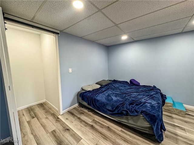38 Lake Dr, Parkersburg, WV 26104 - bedroom with wood finished floors, a paneled ceiling, and recessed lighting