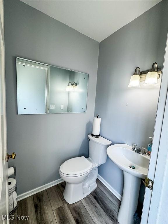 38 Lake Dr, Parkersburg, WV 26104 - half bathroom featuring toilet and wood finished floors
