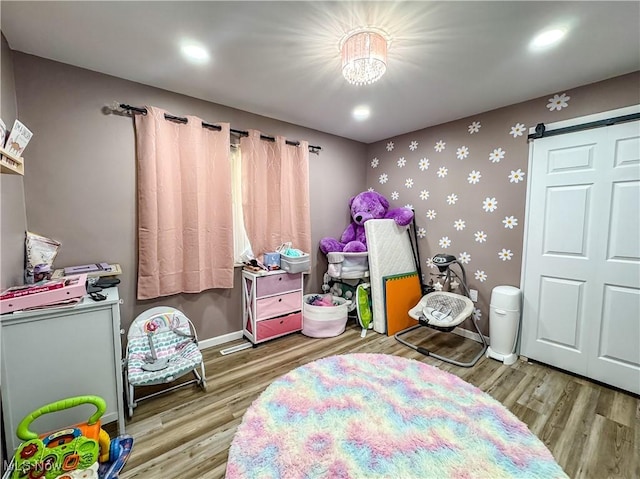 38 Lake Dr, Parkersburg, WV 26104 - bedroom with wood finished floors, wallpapered walls, and recessed lighting