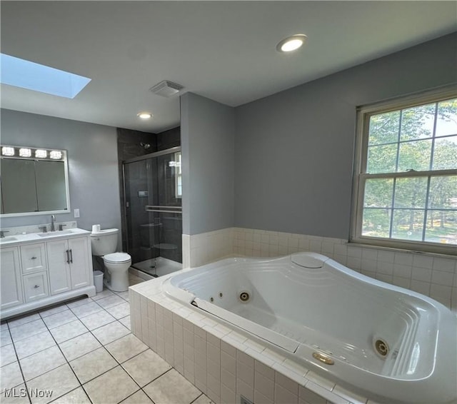 38 Lake Dr, Parkersburg, WV 26104 - bathroom featuring vanity, a stall shower, a whirlpool tub, a skylight, and tile patterned flooring