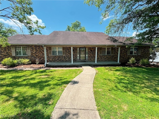 38 Lake Dr, Parkersburg, WV 26104 - ranch-style home with a front yard, covered porch, brick siding, and roof with shingles