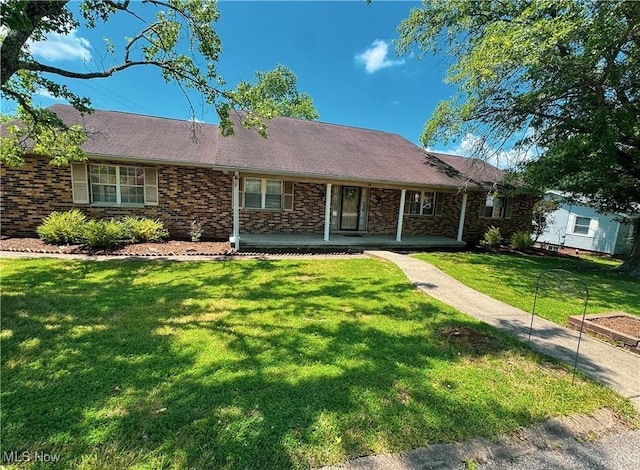 38 Lake Dr, Parkersburg, WV 26104 - ranch-style home with a front lawn, a porch, and brick siding