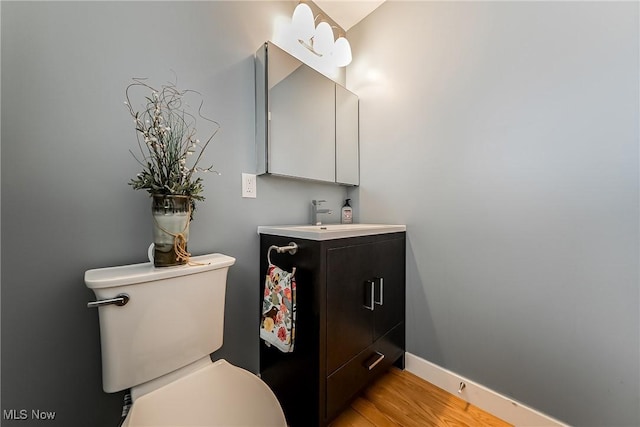 24690 Hawthorne Dr, Euclid, OH 44117 - half bath featuring vanity and wood finished floors