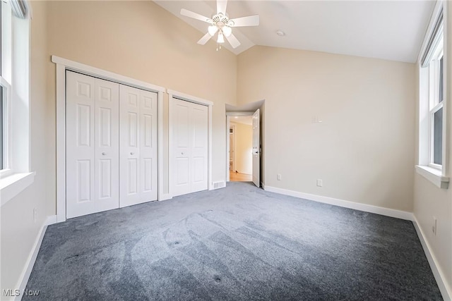 24690 Hawthorne Dr, Euclid, OH 44117 - unfurnished bedroom with multiple closets, carpet floors, high vaulted ceiling, and ceiling fan