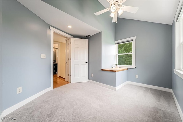 24690 Hawthorne Dr, Euclid, OH 44117 - spare room featuring carpet flooring, ceiling fan, lofted ceiling, and recessed lighting
