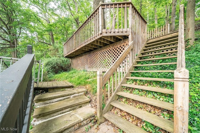 24690 Hawthorne Dr, Euclid, OH 44117 - wooden terrace with stairway and a forest view