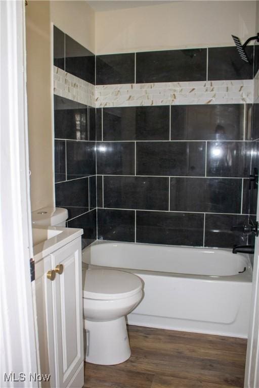 2951 Toledo Ave, Lorain, OH 44055 - full bath with vanity,  shower combination, and wood finished floors
