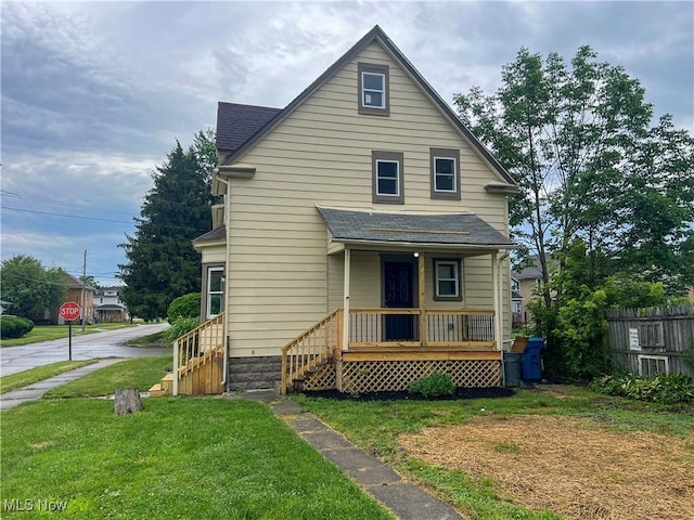 2951 Toledo Ave, Lorain, OH 44055 - view of front of property featuring a porch and roof with shingles