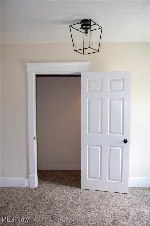 2951 Toledo Ave, Lorain, OH 44055 - unfurnished dining area featuring carpet floors and baseboards