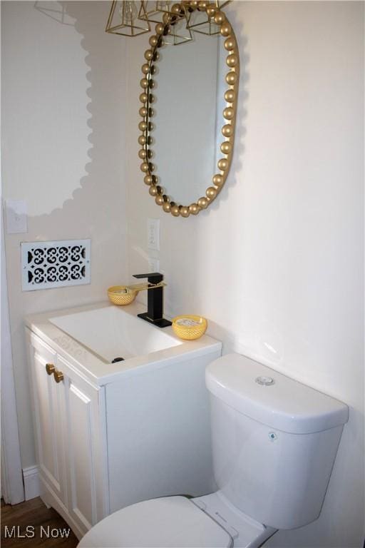 2951 Toledo Ave, Lorain, OH 44055 - half bathroom with vanity and toilet