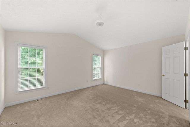 4877 Highland Place Ct, Richmond Heights, OH 44143 - unfurnished room featuring vaulted ceiling, light carpet, and plenty of natural light