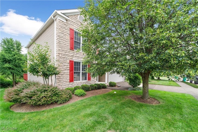 4877 Highland Place Ct, Richmond Heights, OH 44143 - view of front of house with stone siding, driveway, a front yard, and an attached garage