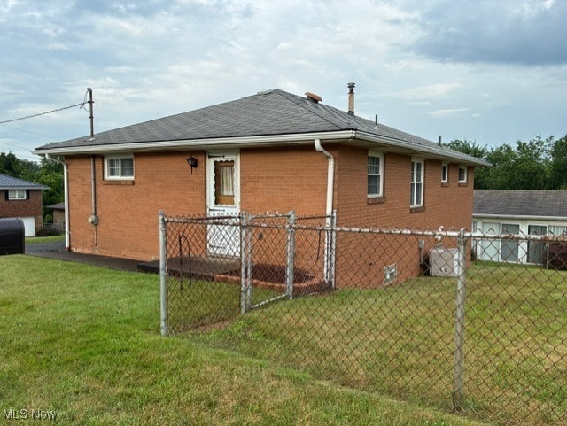 120 Braxton Rd, Weirton, WV 26062 - rear view of house with brick siding and oil tank