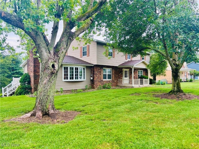 224 N Hills Dr, Parkersburg, WV 26104 - rear view of property featuring a lawn and brick siding