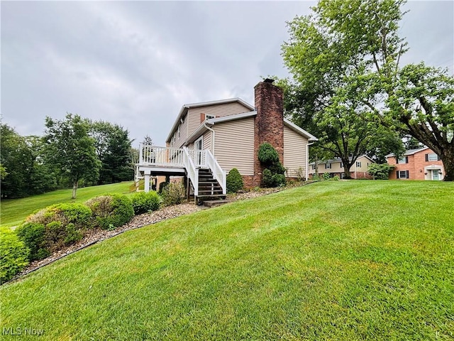 224 N Hills Dr, Parkersburg, WV 26104 - view of side of home featuring a chimney, a deck, stairway, and a lawn