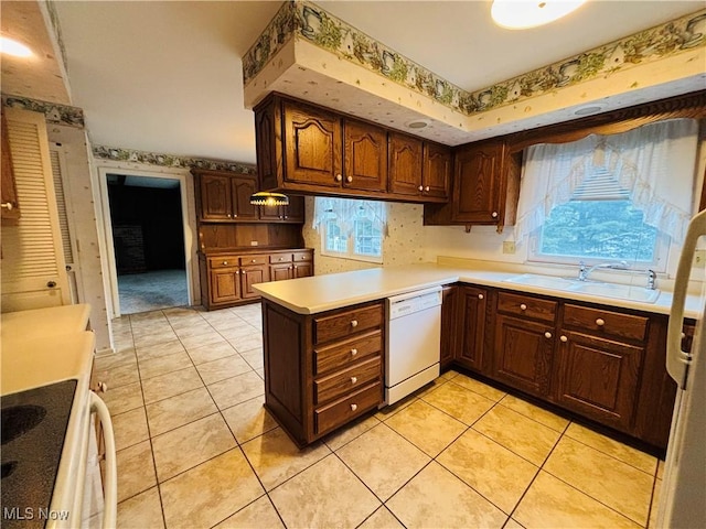 224 N Hills Dr, Parkersburg, WV 26104 - kitchen featuring dishwasher, wallpapered walls, plenty of natural light, a peninsula, and light countertops