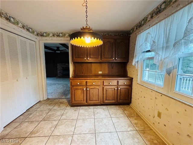 224 N Hills Dr, Parkersburg, WV 26104 - unfurnished dining area with wallpapered walls, ceiling fan, and light tile patterned flooring
