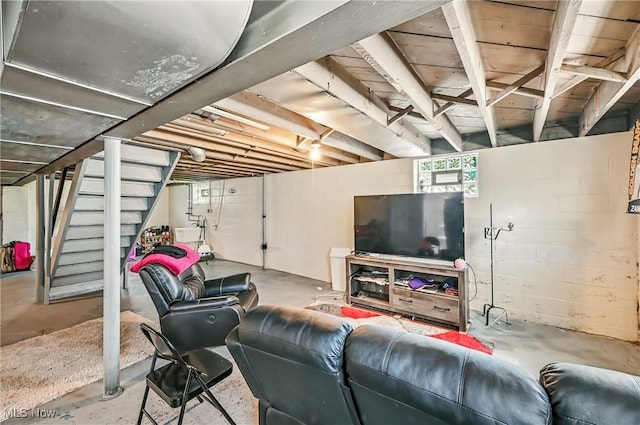 565 12th St, Campbell, OH 44405 - living area featuring stairs and concrete flooring