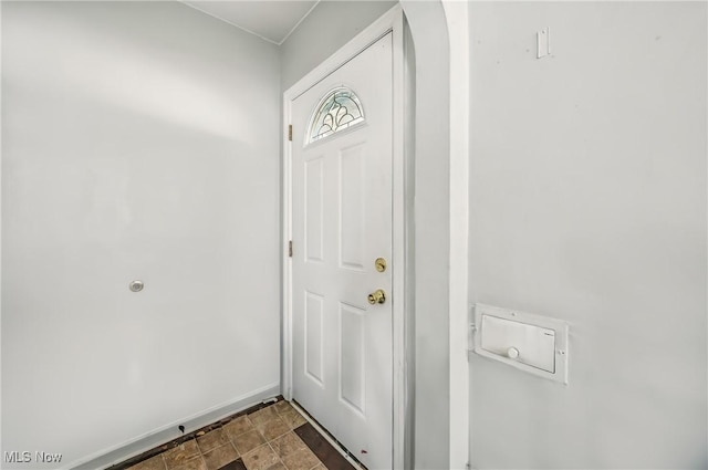565 12th St, Campbell, OH 44405 - entryway featuring baseboards and dark stone finish floors