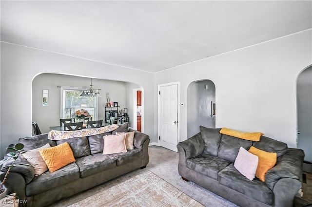 565 12th St, Campbell, OH 44405 - carpeted living area featuring arched walkways and a chandelier