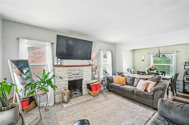 565 12th St, Campbell, OH 44405 - living room with healthy amount of natural light and a stone fireplace