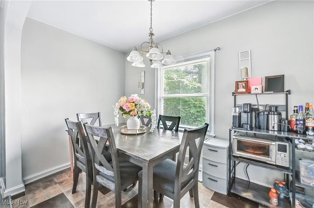 565 12th St, Campbell, OH 44405 - dining space with a chandelier and stone finish flooring