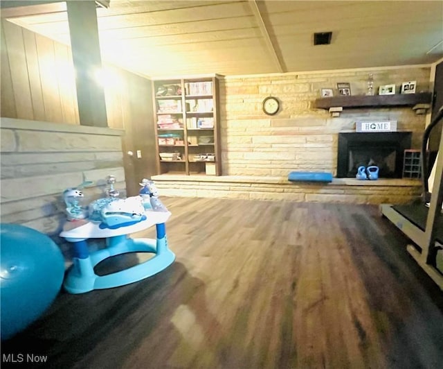 91070 Kilgore Ridge Rd, Scio, OH 43988 - living area featuring wood finished floors, wood ceiling, a fireplace, wood walls, and built in features