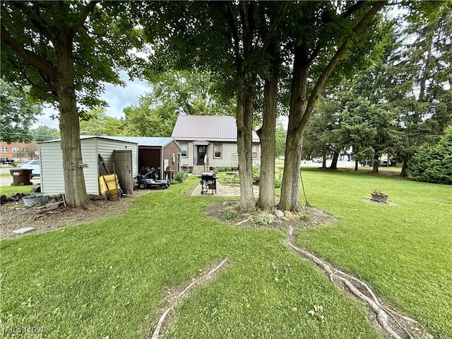 7 W Main St, Savannah, OH 44874 - view of green lawn featuring an outbuilding
