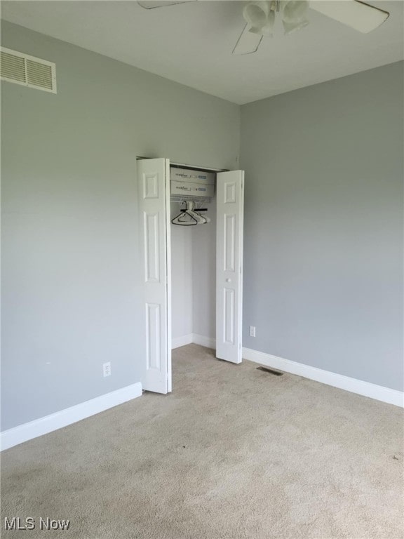 54856 Winding Hill Rd, Bellaire, OH 43906 - unfurnished bedroom with carpet flooring, a ceiling fan, and a closet