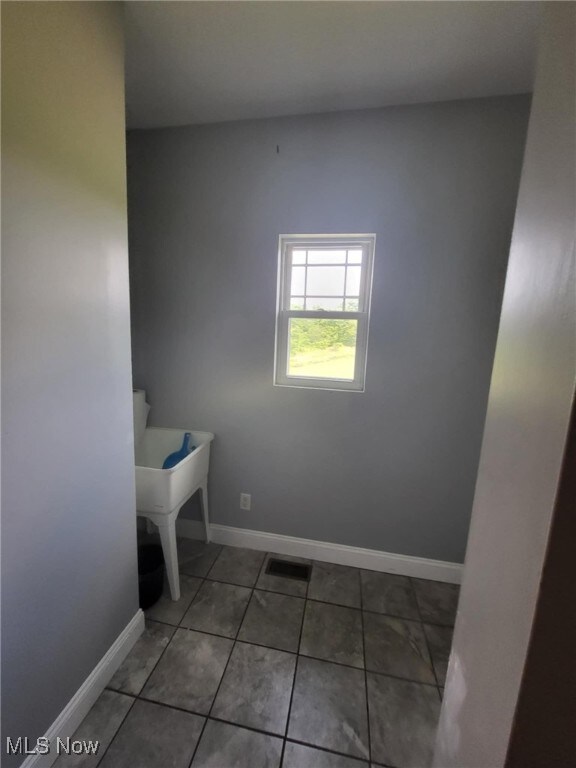 54856 Winding Hill Rd, Bellaire, OH 43906 - washroom with baseboards and tile patterned flooring