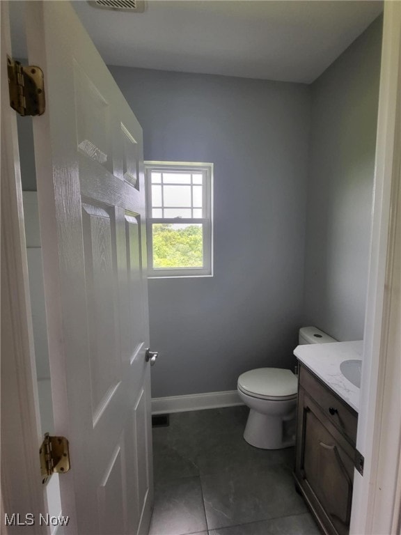 54856 Winding Hill Rd, Bellaire, OH 43906 - bathroom with vanity and tile patterned flooring