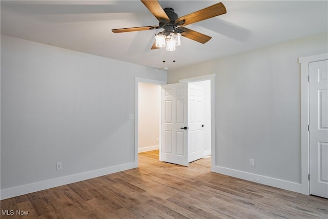 1404 15th St, Vienna, WV 26105 - unfurnished bedroom with wood finished floors and ceiling fan