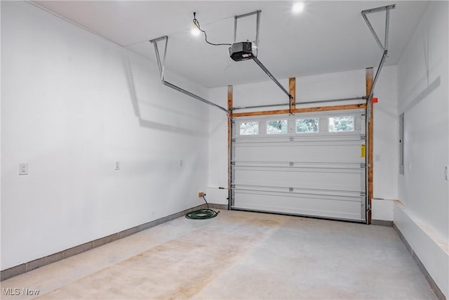 1404 15th St, Vienna, WV 26105 - garage with a garage door opener and baseboards