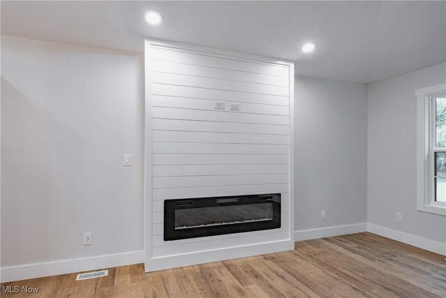 1404 15th St, Vienna, WV 26105 - detailed view of a fireplace, wood finished floors, and recessed lighting