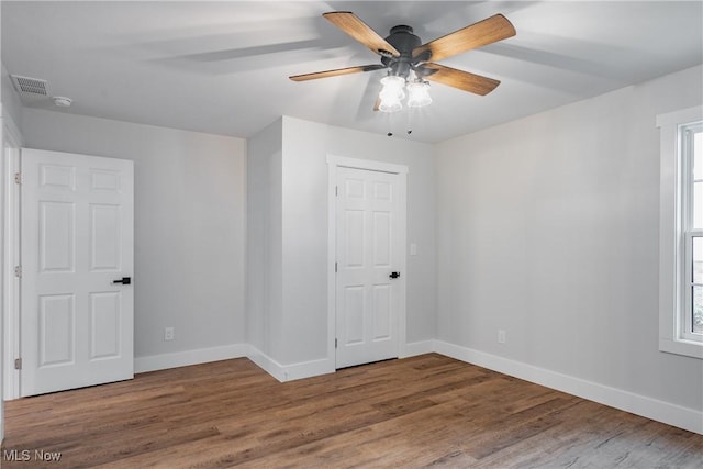 1404 15th St, Vienna, WV 26105 - empty room with ceiling fan, wood finished floors, and a smoke detector