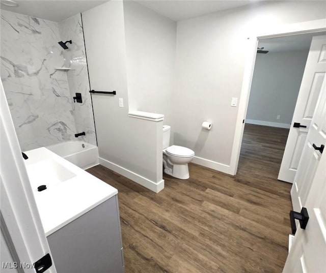 1404 15th St, Vienna, WV 26105 - full bath featuring vanity, wood finished floors, and a combined bath / shower with marble appearance