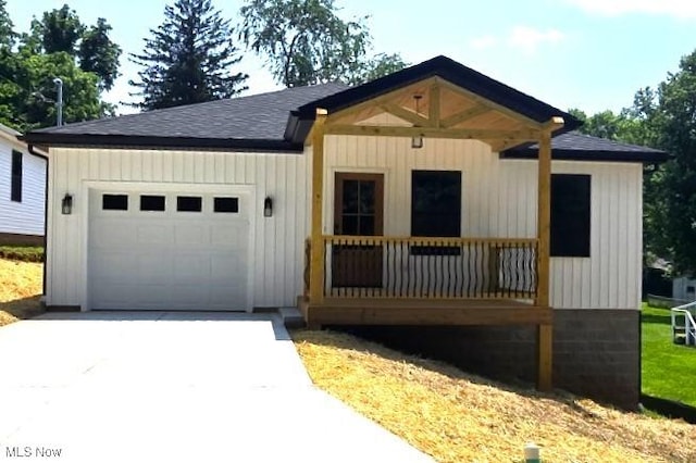 1404 15th St, Vienna, WV 26105 - modern inspired farmhouse featuring an attached garage, driveway, and a shingled roof