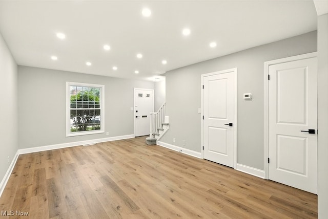 5830 Spotswood Dr, Lyndhurst, OH 44124 - unfurnished room featuring recessed lighting, light wood-style flooring, and stairway
