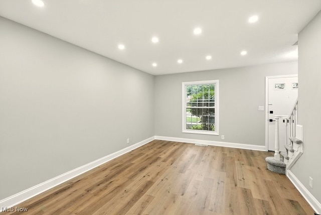 5830 Spotswood Dr, Lyndhurst, OH 44124 - unfurnished room featuring recessed lighting, light wood-style floors, and stairs