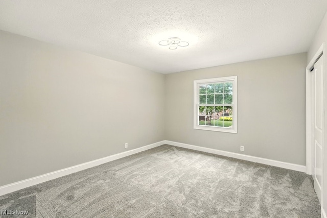 5830 Spotswood Dr, Lyndhurst, OH 44124 - spare room with carpet flooring and a textured ceiling